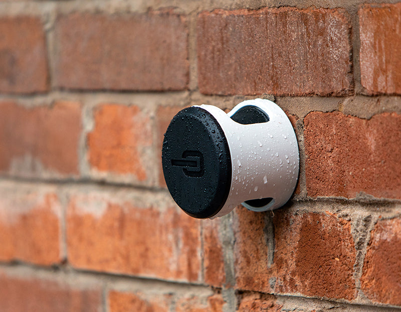 Hiplok ANKR bicycle wall anchor attached to brick wall in rain