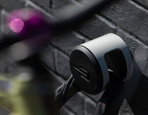 Mountain Bike locked to wall achor with a chain bike lock