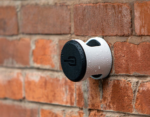 Hiplok ANKR bicycle wall anchor attached to brick wall in rain