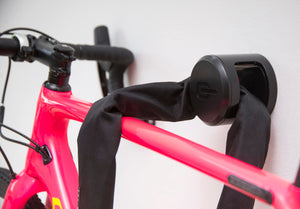 ANKR attached to indoor wall locking roadbike with a chain lock