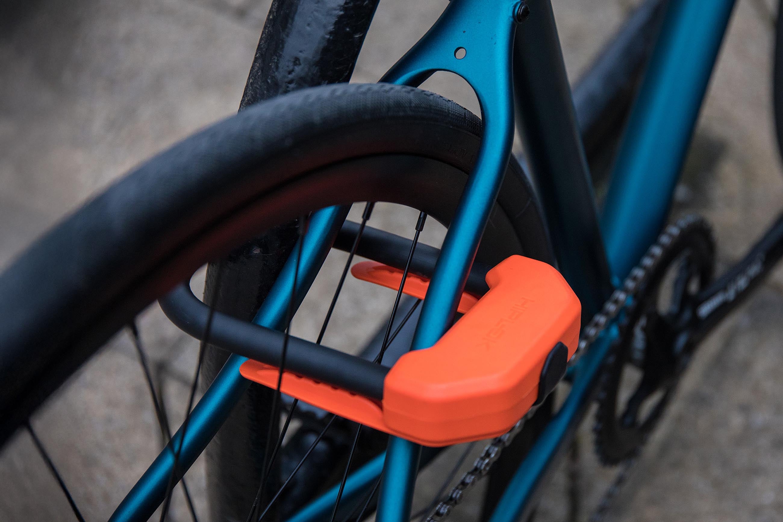bike rear wheel locked to metal bike rack with d lock