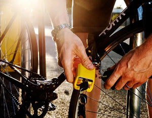 male locking bike with chain lock through front wheel and frame